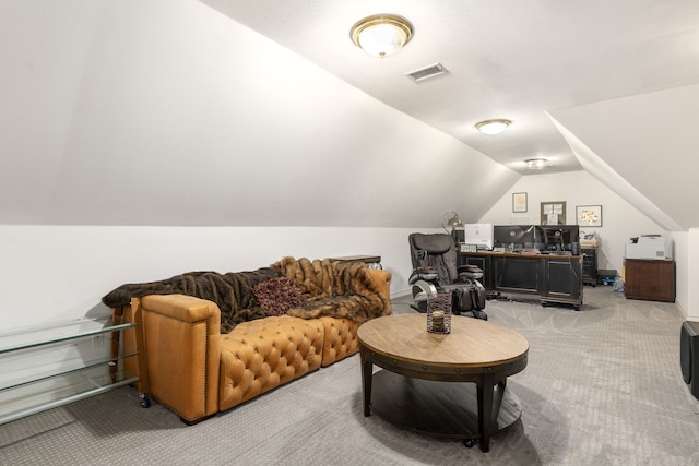 living area with light carpet, lofted ceiling, and visible vents