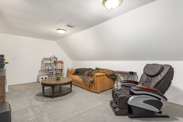 interior space with baseboards, carpet, lofted ceiling, and visible vents