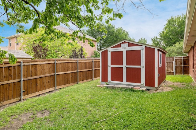 view of shed with a fenced backyard
