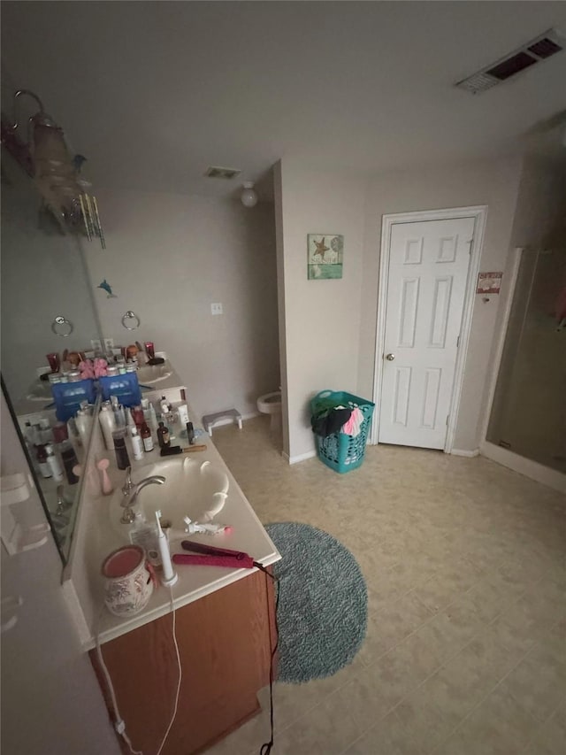 bathroom with visible vents and vanity