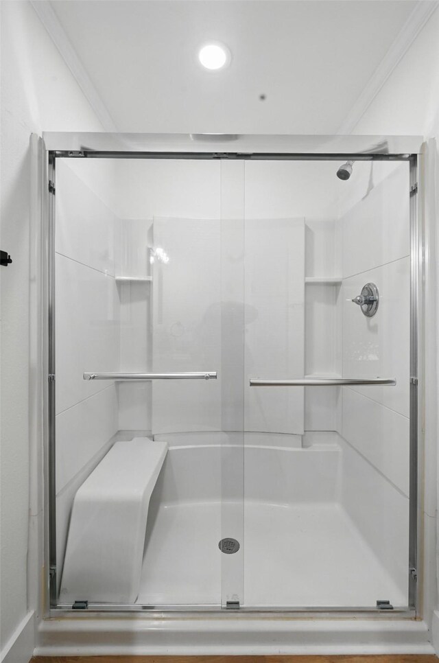 bathroom with a stall shower and recessed lighting