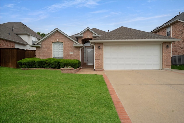 single story home featuring brick siding, central air condition unit, and driveway