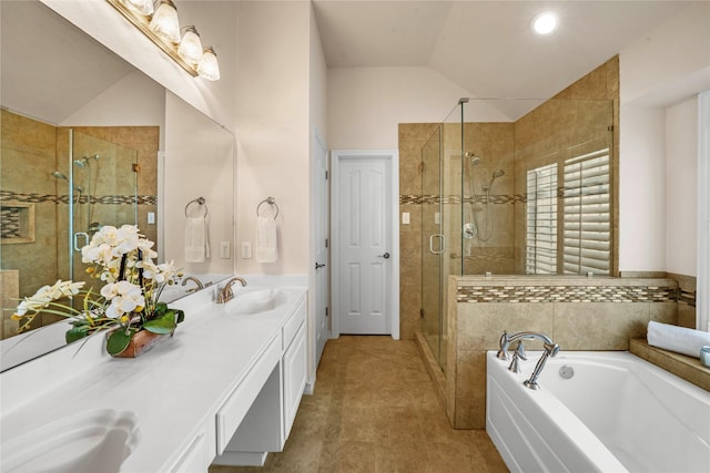 full bath featuring double vanity, a bath, a shower stall, a sink, and lofted ceiling