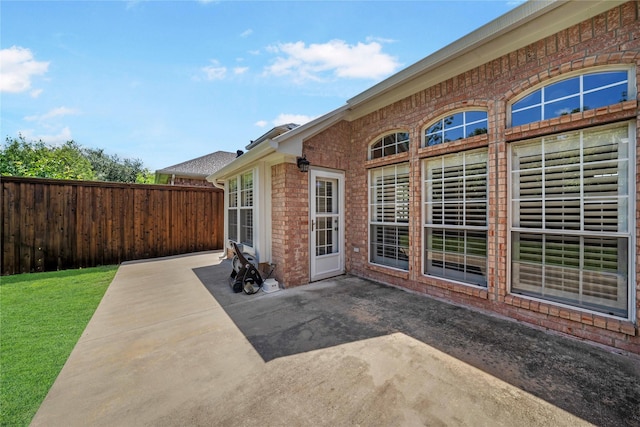 view of patio / terrace featuring fence