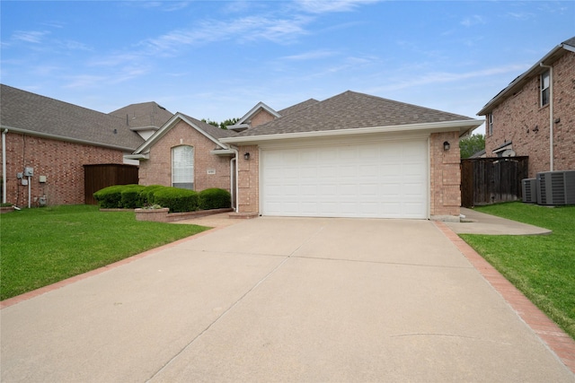 single story home with a front lawn, roof with shingles, brick siding, central AC unit, and driveway
