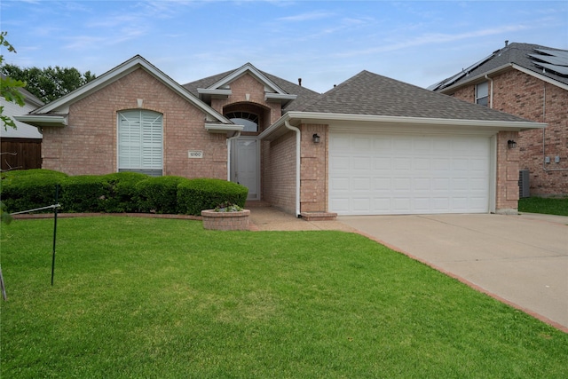 ranch-style home featuring a front yard, roof with shingles, brick siding, concrete driveway, and an attached garage