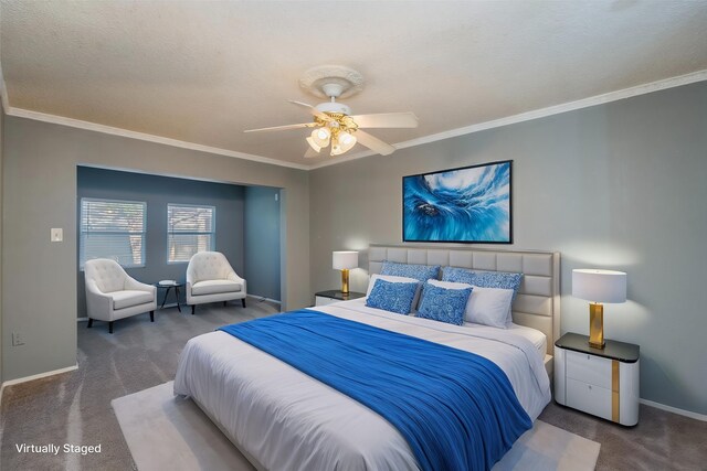 carpeted bedroom featuring baseboards, ornamental molding, and a ceiling fan