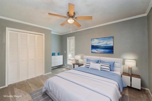 bedroom with crown molding, baseboards, carpet, and a closet