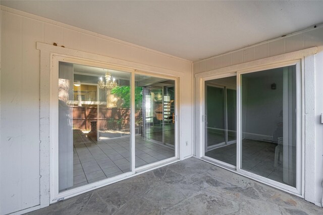 exterior space featuring a chandelier