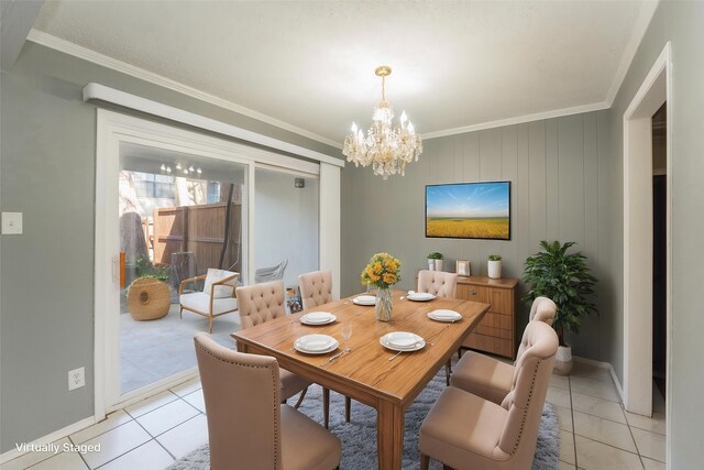 dining room featuring crown molding, light tile patterned floors, and a chandelier