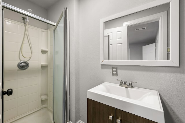 3544 Parker Rd E, Haltom City, TX 76117 - bathroom with visible vents, a shower stall, and vanity