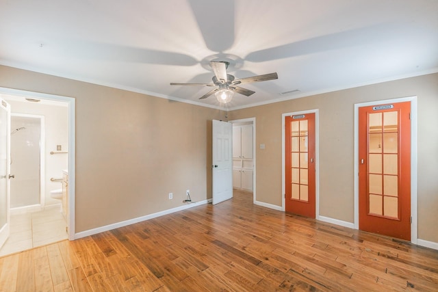 836 Springdale Rd, Bedford, TX 76021 - unfurnished bedroom featuring crown molding, ensuite bathroom, and wood finished floors