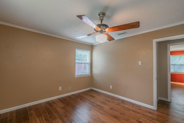 836 Springdale Rd, Bedford, TX 76021 - spare room featuring baseboards, plenty of natural light, dark wood-style flooring, and visible vents