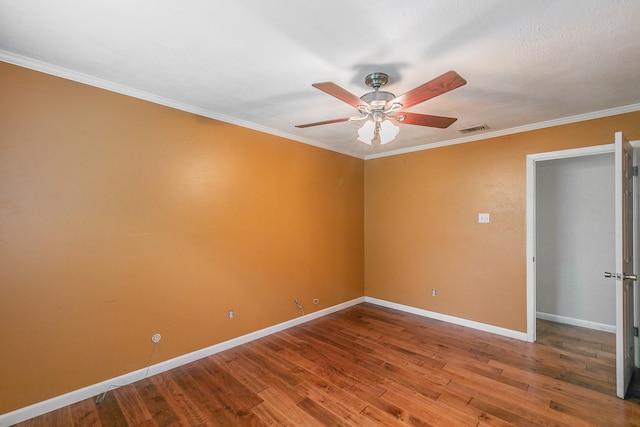 836 Springdale Rd, Bedford, TX 76021 - spare room featuring crown molding, ceiling fan, baseboards, wood finished floors, and visible vents