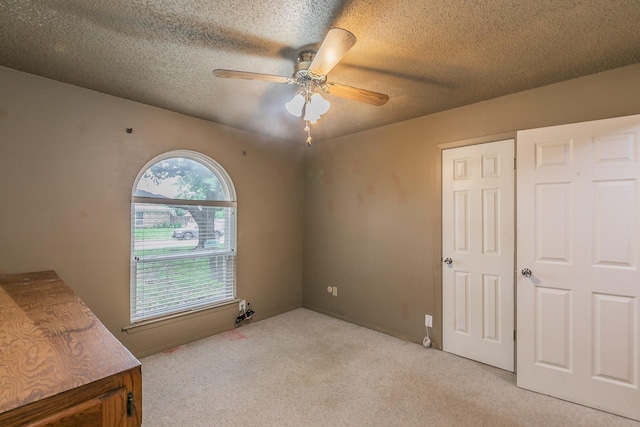836 Springdale Rd, Bedford, TX 76021 - empty room with light carpet, a ceiling fan, and a textured ceiling
