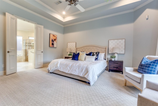 bedroom with crown molding, connected bathroom, light colored carpet, baseboards, and visible vents