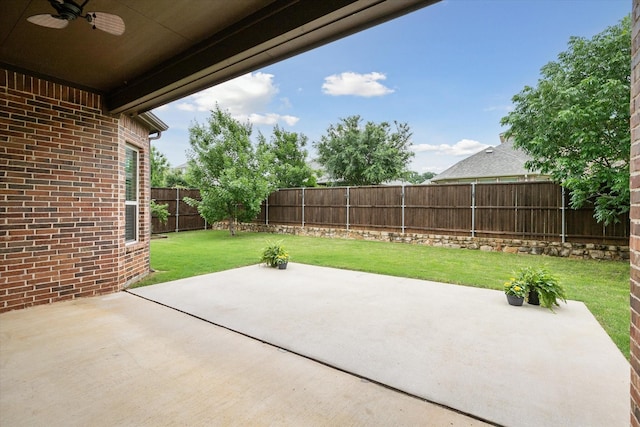 view of patio with ceiling fan and a fenced backyard