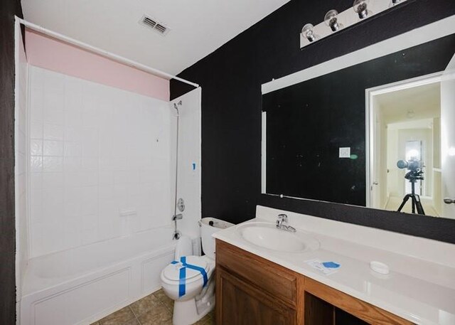 full bathroom featuring vanity, toilet, tile patterned floors, bathing tub / shower combination, and visible vents