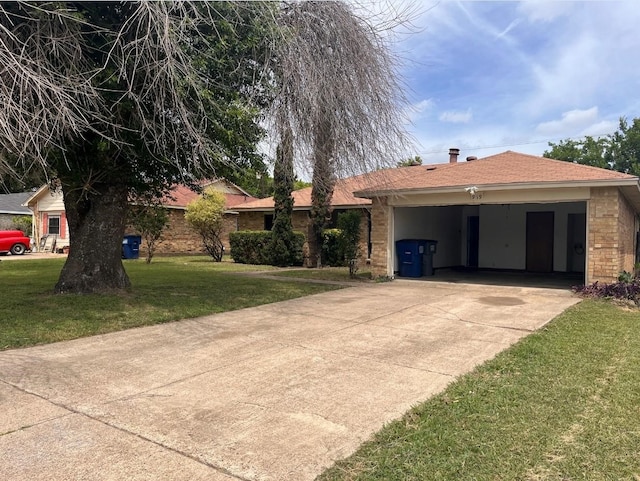 ranch-style home with an attached garage, a front lawn, brick siding, and concrete driveway