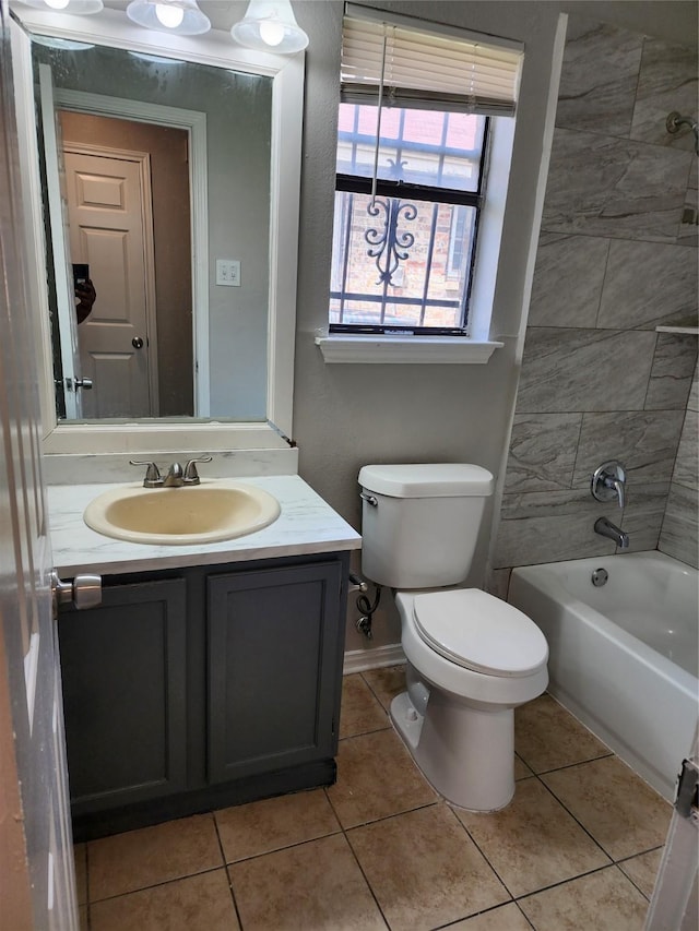 full bathroom with vanity, toilet, baseboards, washtub / shower combination, and tile patterned floors