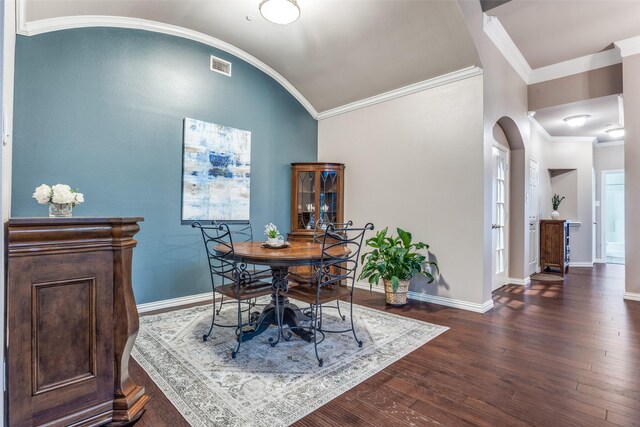 living area featuring ceiling fan, dark wood-style flooring, a high ceiling, baseboards, and ornamental molding