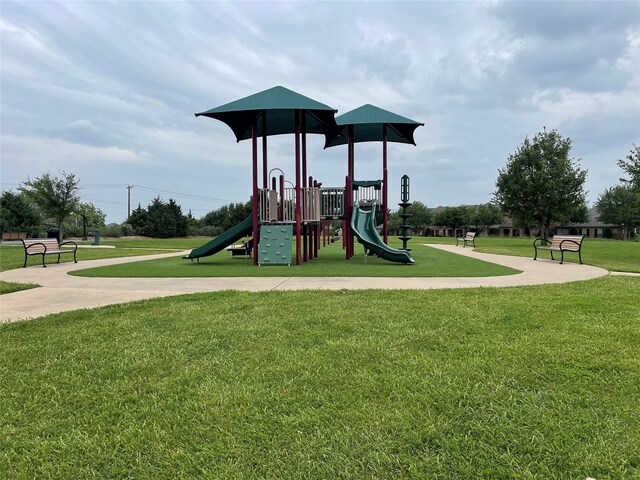 community play area with a lawn