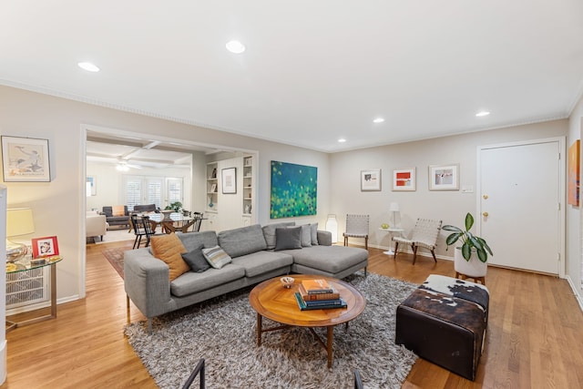 living area with baseboards, ceiling fan, light wood-type flooring, and recessed lighting