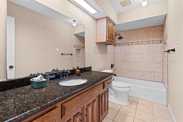 full bath featuring visible vents, tile patterned flooring, vanity, toilet, and shower / bathing tub combination