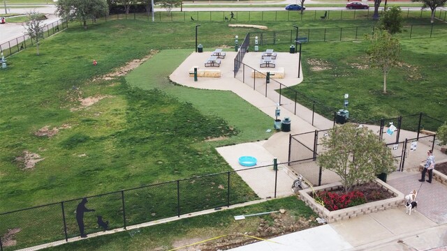 surrounding community featuring fence and a yard