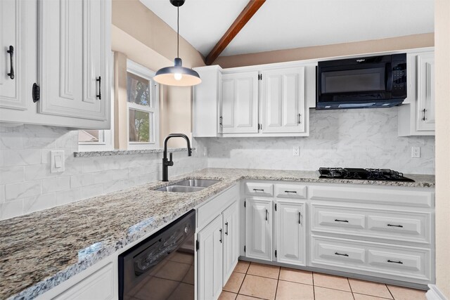 kitchen featuring light stone countertops, lofted ceiling with beams, a sink, white cabinetry, and black appliances