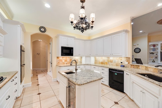 kitchen featuring a sink, arched walkways, black appliances, and beverage cooler