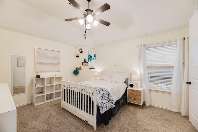bedroom featuring baseboards, ornamental molding, a ceiling fan, and carpet flooring