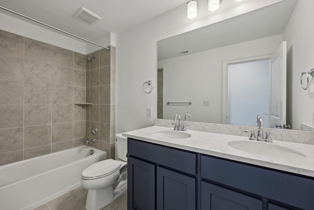 full bathroom featuring toilet, visible vents, and a sink