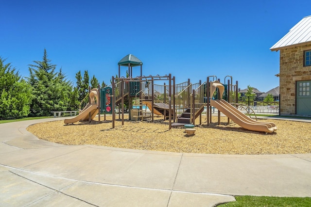 communal playground featuring fence
