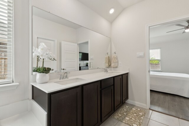 full bath with a sink, a ceiling fan, ensuite bath, and tile patterned floors