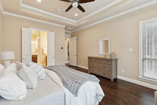 bedroom featuring a raised ceiling, ornamental molding, baseboards, and dark wood-type flooring