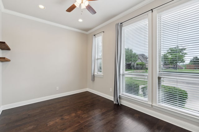 unfurnished room featuring plenty of natural light, a ceiling fan, dark wood finished floors, and baseboards
