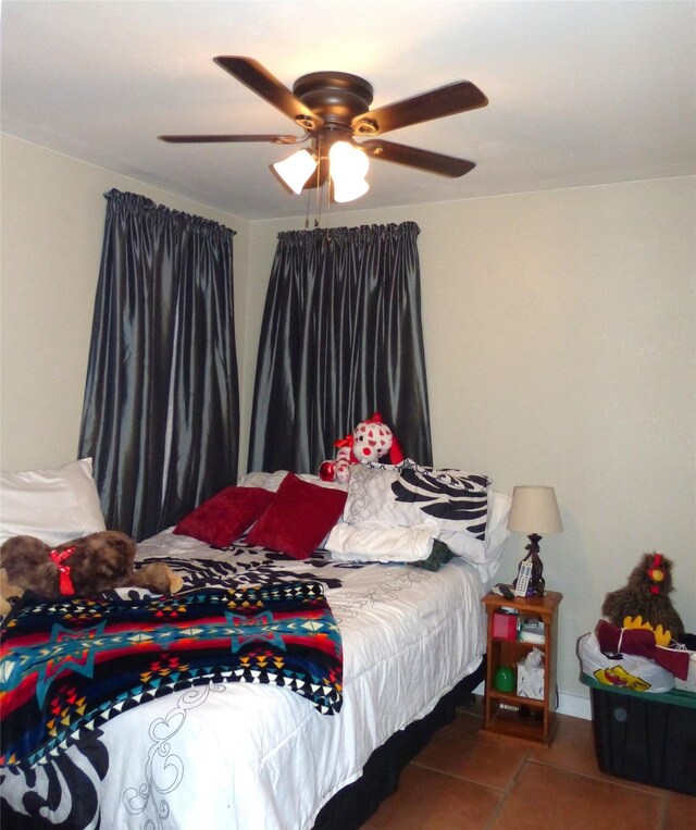 bedroom featuring tile patterned flooring and a ceiling fan