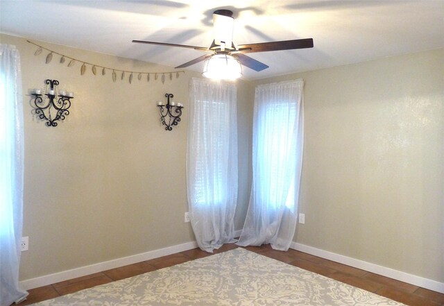 unfurnished room with a ceiling fan