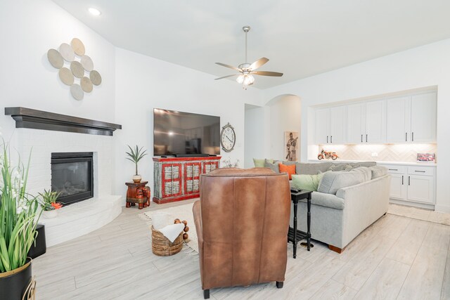 1925 Braided Mane Ave, Aubrey, TX 76227 - living area featuring arched walkways, recessed lighting, light wood finished floors, and ceiling fan