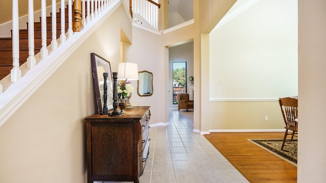 1230 Covina Ct, Allen, TX 75013 - hallway featuring light tile patterned floors, baseboards, and a high ceiling