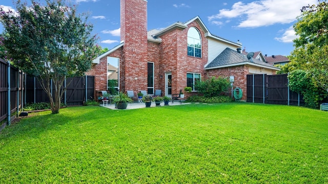 1230 Covina Ct, Allen, TX 75013 - back of house with a chimney, a patio area, brick siding, and roof with shingles