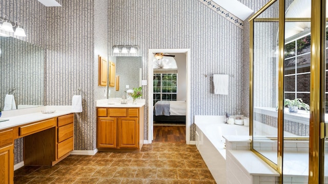 1230 Covina Ct, Allen, TX 75013 - ensuite bathroom featuring wallpapered walls, ceiling fan, vanity, and a bath