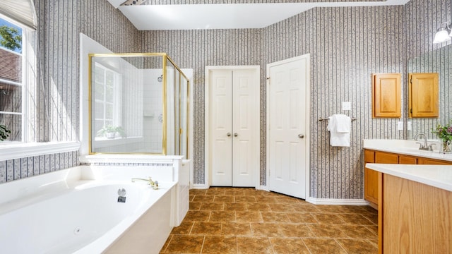 1230 Covina Ct, Allen, TX 75013 - full bathroom with wallpapered walls, a shower stall, a bath, vanity, and baseboards