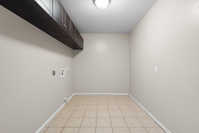603 Sunnyvale Ln, Fairfield, TX 75840 - washroom featuring baseboards, hookup for a washing machine, cabinet space, light tile patterned floors, and hookup for an electric dryer