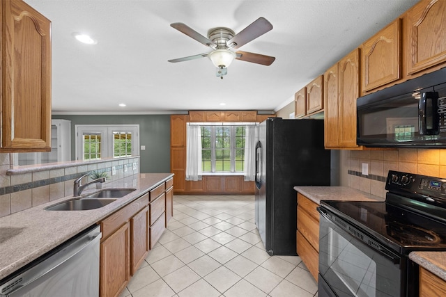 603 Sunnyvale Ln, Fairfield, TX 75840 - kitchen with a sink, decorative backsplash, black appliances, and a healthy amount of sunlight