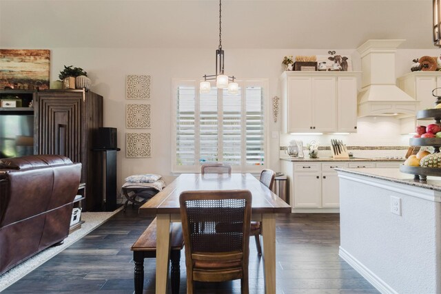 dining space with dark wood-type flooring
