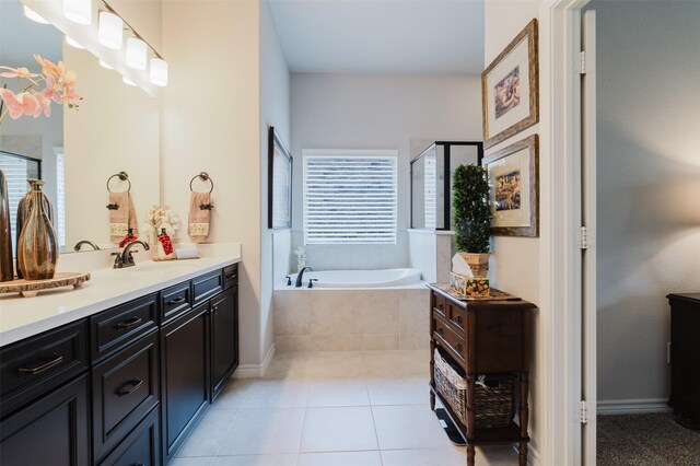 bathroom featuring tile patterned floors, a shower stall, a garden tub, and vanity