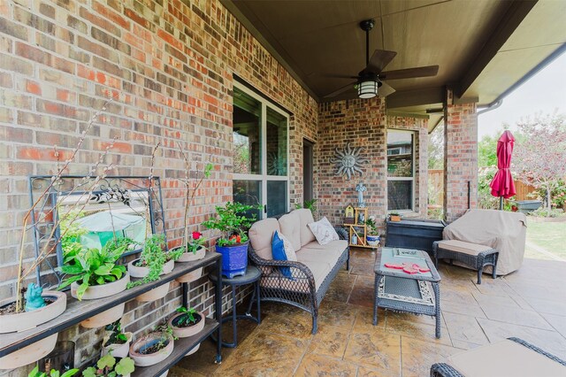 view of patio with outdoor lounge area and a ceiling fan