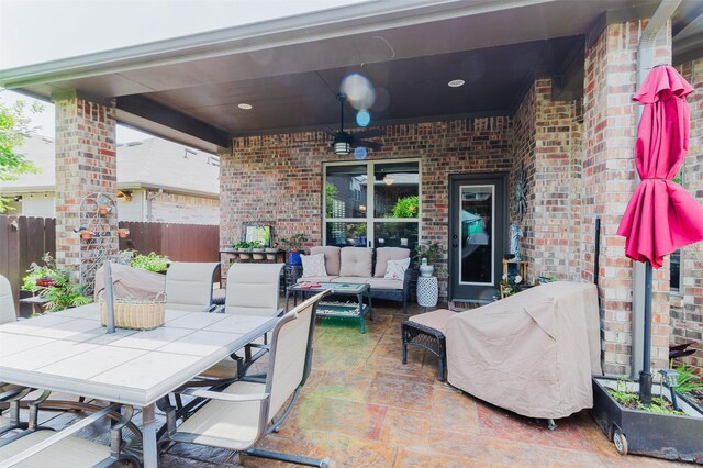 view of patio featuring fence and outdoor lounge area